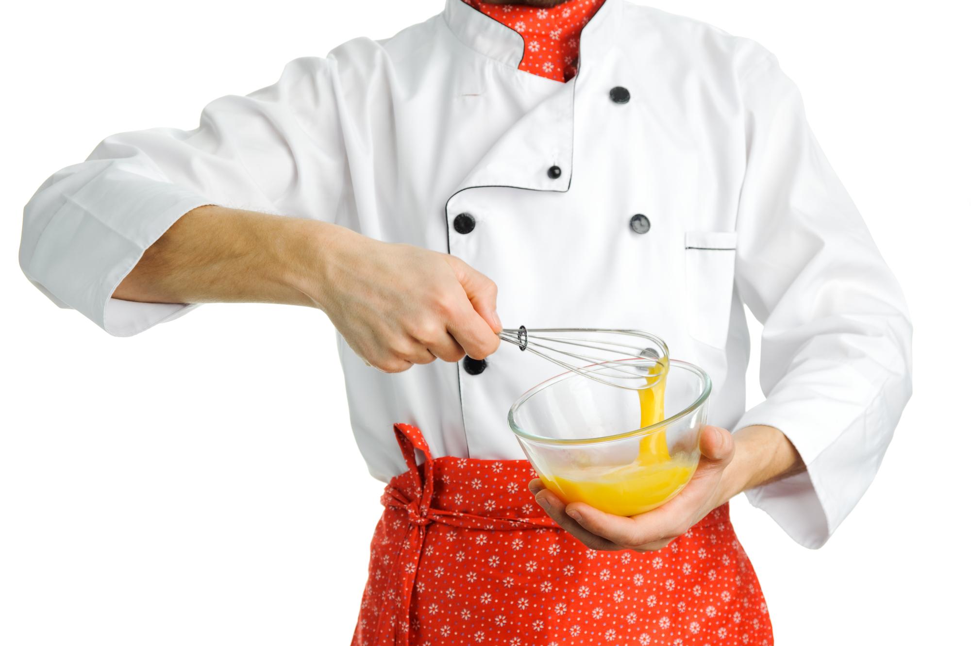 Student plating a dish in class
